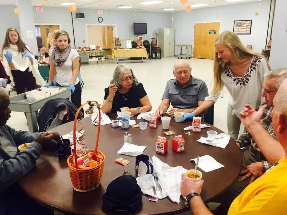 VTHS freshmen serve the senior citizens during a recent fashion show.