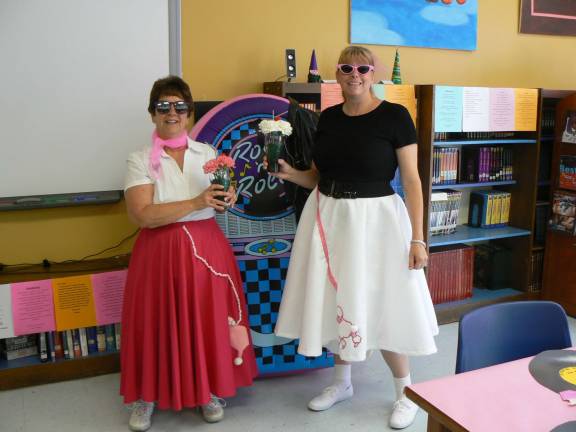 Volunteers appreciated at Lounsberry Hollow Middle School Janice Mitchell and Barbara Monschauer, co-chairs of the volunteer appreciation brunch, dressed as sock hoppers