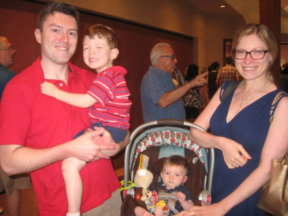 PHOTO BY JANET REDYKE Proud dad Michael Reynolds and sons Michael and Christopher and wife Katherine stop for a photo after mass at St. Francis de Sales Church on Father&#x2019;s Day.