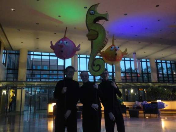 Little Mermaid cast members Dalton Allison, of Byram, Grace Brizek, of Sparta, and Justin Watt, of Mansfield, greet guests at the event.