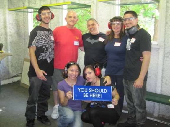 Franklin Revolver &amp; Rifle Association member, Bob Uzzalino, invited his niece and her family for an afternoon of fun at the Girls, Guys &amp; Guns Event held in July 2014. Pictured above standing are Nicholas Fantauzzi, Bob Uzzalino, Ruben Fantauzzi Sr., Debbie Fantauzzi, Ruben D. Fantauzzi , and kneeling are Nicole Fantauzzi and Marisa Fantauzzi. Their smiles and sign tell it all!