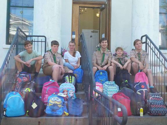 Members of Boy Scout Troop 283 from Vernon collected and delivered school supplies to Ginnie's House in Newton. They filled many backpacks to be distributed to children for the new school year.