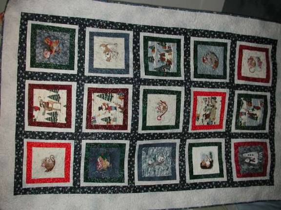 Area sewing clubs needle away An embroidered blanket.