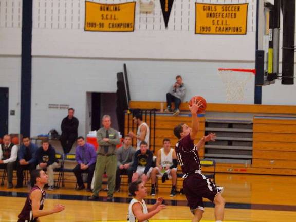 Newton routs Vernon, 72-44 Newton's Frankie Rios soars towards the net. Rios led his team in scoring with 25 points.
