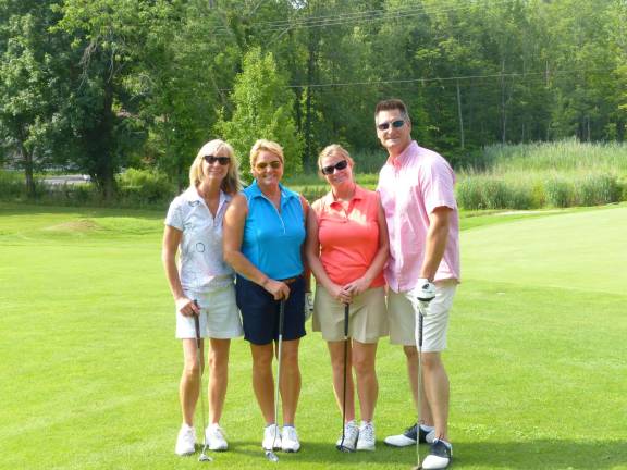 A group of golfers pose during the 2013 K.E.E.P. golf outing.