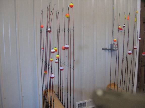 PHOTOS BY JANET REDYKE Poles await anxious fisher boys and girls on Wallkill River Refuge&#x2019;s Nature Kid Fishing Day.