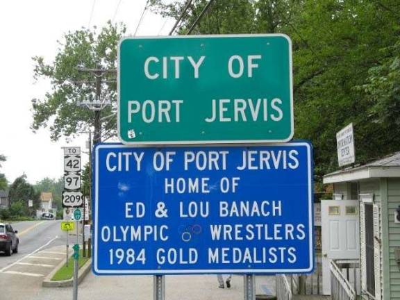 Banach brothers of wrestling fame to deliver inspirational speeches Sign at the entrance to Port Jervis pays tribute to the Banach Olympians (Photo provided)