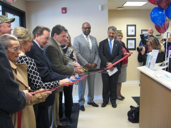 St. Clare, town officials and distinguished guests cut the red ribbon opening the Sussex Community Urgent Care Center.