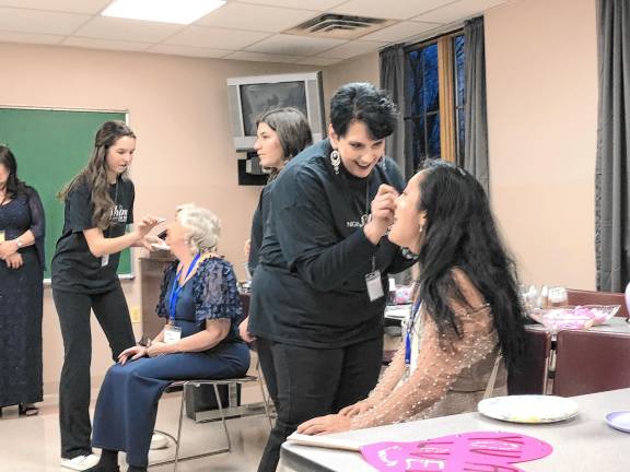 Giving others a Night to Shine <b>Guests are made up before the Night to Shine event last year at St. Francis de Sales Church in Vernon. </b>