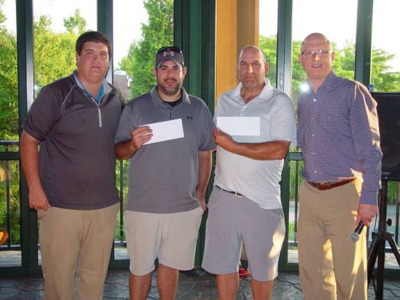 The Winning team of Perry Kasturas and Mike Criscuoli receive their prize from Director of Golf Adam Donlin (right).