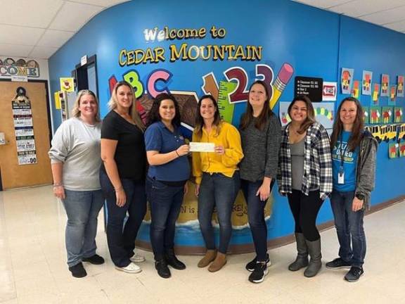 Pictured from left to right: Ericka Petrucci (CM SCA Recording Secretary), Rachel Cawley (CM SCA Treasurer), Caitlin Piccirillo (Mission Realty Company Sales Associate), Megan Kapusta (CM SCA President), Rose Ahearn (CM SCA Vice President), Viviana Quiros (CM SCA Corresponding Secretary), and Kristen Gudenkauf (Cedar Mountain Acting Principal).