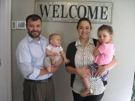 Physical therapists Andrew Martino and Sarah Spence and their daughters Liliana and Mia welcome all to the new center.