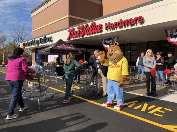 Shoppers line up to enter the new store. (Photo by Kathy Shwiff)