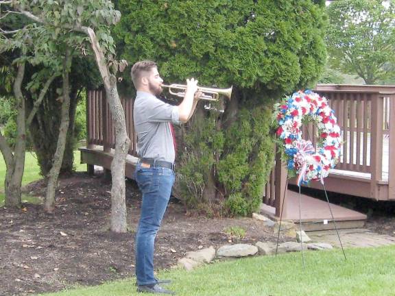 Taps is sounded as a final tribute (Photo by Janet Redyke)
