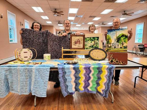 Lord’s Auction is today <b>Tranquility United Methodist Church members, from left, Barbara Morgan, Kevin Conn, and Charlene and Rich Gardiner with items to be sold in the Lord’s Auction on Saturday, Aug. 31. (Photo provided)</b>