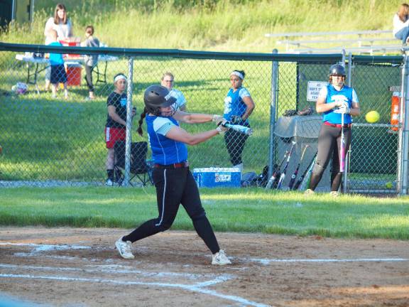 Blue batter Milena Lacatena swats one. Lacatena attends Lenape Valley Regional High School in Stanhope.