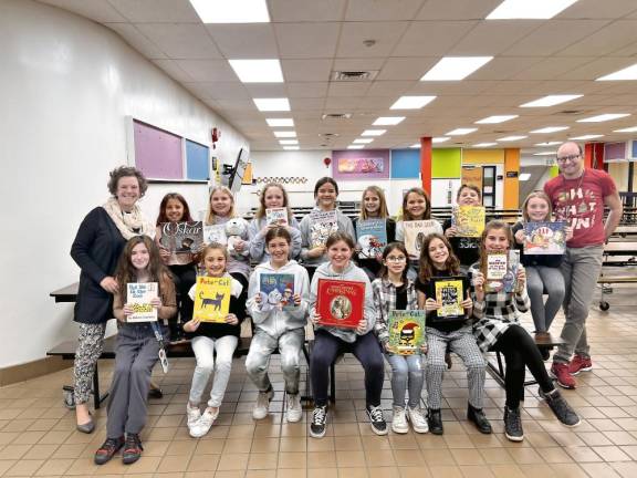 Lounsberry Hollow students read to younger children Members of the K-Kids Club at Lounsberry Hollow School with their advisers, Cheryl Reed and Teddy Babich.
