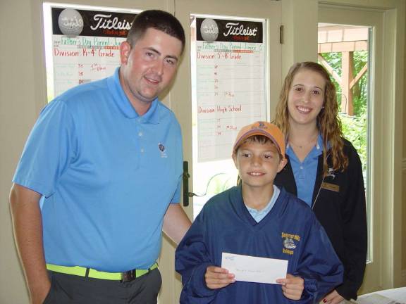Crystal Springs hosts Father's Day golf Junior golfer Sam Weiss takes closest to the pin honors.
