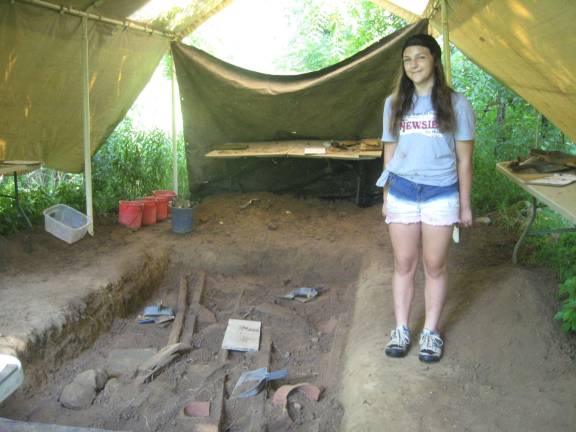 Caterina Pleva points out the dig site.