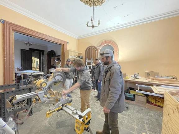 SCCC students help renovate historic Horton Mansion on campus Students in the Building Construction Technology program at Sussex County Community College are instructed by their professor on the proper use of the equipment. (Photos courtesy of Sussex County Community College)