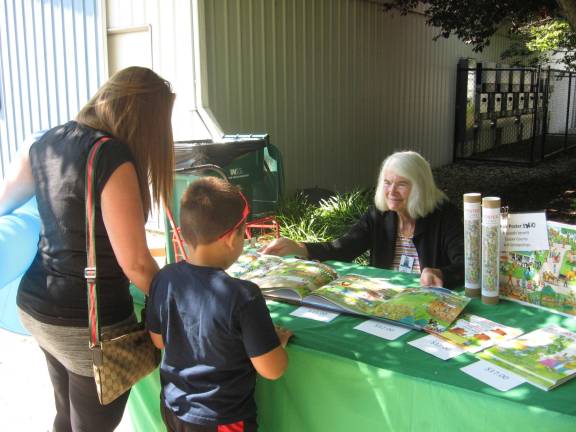 Local author Elizabeth Rodger meets fairgoers and displays her children&#x2019;s book, &#x201c;A Carrot for Billy.&#x201d;