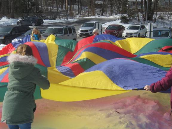 Highland Lakes hosts winter carnival The Parachute Obstacle Course was fun and enjoyed by all.