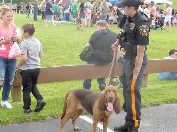 Officer Young and service bloodhound Nutmeg of the Sussex County Sheriff’s Department (Photo by Janet Redyke)