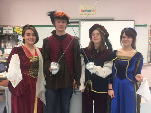 From left, Julianna Schlichting, David MacMillan, Christine Birkland and Alyssa Koehler pose for their applause after performing their original skit which showed a range of behaviors, from handkerchief dropping to gauntlet throwing to a pair of duels.