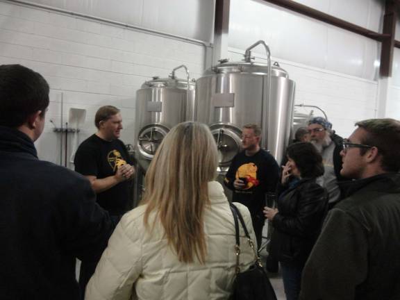 Angry Erik grand opening a hit, despite snow Erik Hassing gives a tour of the brewery.