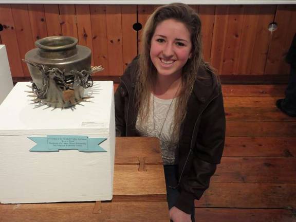 Getting creative Wallkill Valley Regional High School art student Nicole Bauberger poses next to her clay fired pot which won "Best in Show" at the Wallkill Valley Art Show.