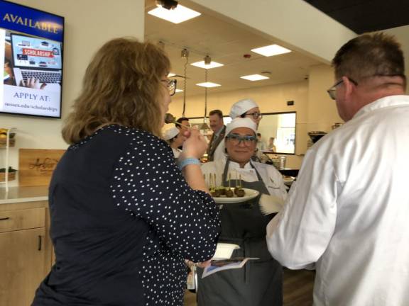 SCCC’s Culinary Institute opens A Sussex County Communty College student serves hors d’oeuvres after the ribbon-cutting ceremony at the college’s new Culinary Institute.