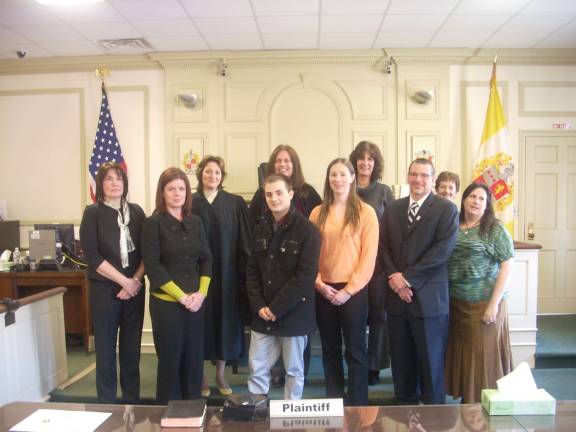 Shown above with The Honorable Catherine I. Enright are nine of eleven new volunteers who were recently sworn in as Court Appointed Special Advocates for Morris and Sussex Counties. The new volunteers shown, from left, are Denise Postlethwaite, Siobhan Sharkey, Judge Enright, Matthew Milone, Cheryl Wallace, Lisa Scott, Miriam Boylan, Jack Marks, Kristen Dawson and Sue Enright.