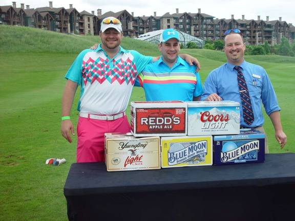 2014 Brews &amp; Birdies champs Joe Shields and Mike Clohessy claim their prize from Crystal Springs Tom Dyer.