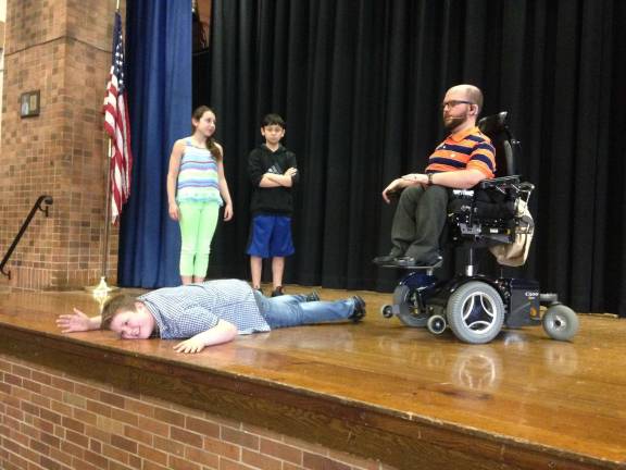 Former student teaches middle schoolers to overcome their 'gravity' D'Agostino engages students at Sussex Middle School in an interactive exercise.