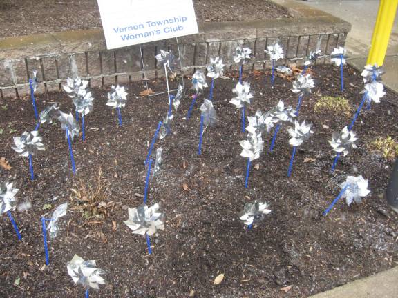 Pinwheels outside the Vernon Town Hall represent happy children.