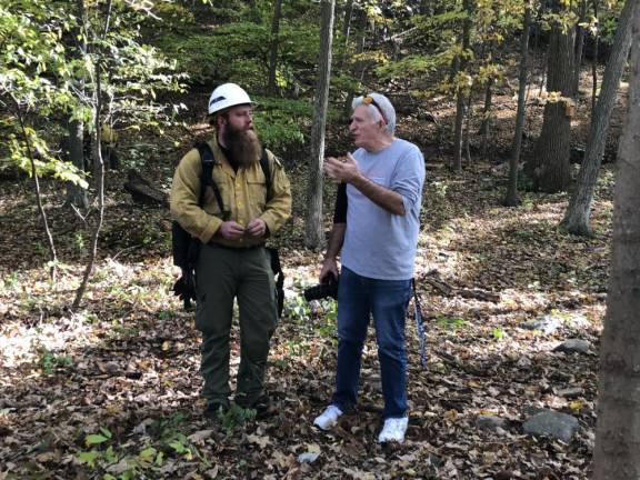 Lighting a fire under science students Nick Valerio, section fire warden A1 with the New Jersey Forest Fire Service, talks to High Point Regional High School science teacher Art Mina before the prescribed burn. (Photo by Kathy Shwiff)