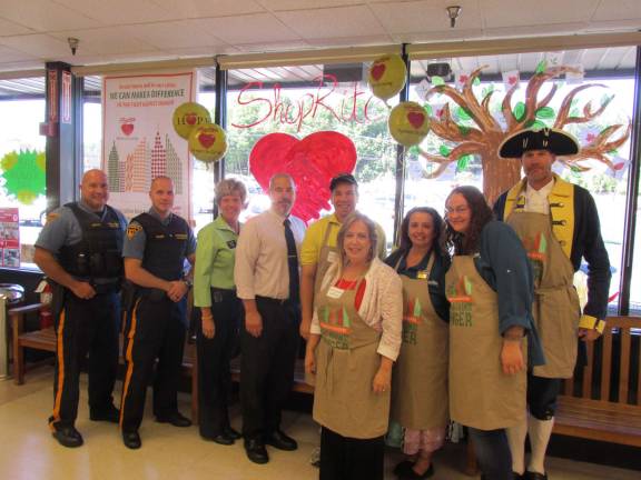 Shown, from left, are: Officer Rafael Burgos, Officer Jeffrey Korger, Cherie Hudson (Customer Service Manager), John DeCarlo (General Store Manager), Jake Checkur, Assemblywoman Alison McHose, Lisa Darcy, Jennifer Campbell, and Paul Checkur as George Washington at Franklin ShopRite.