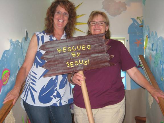 Pastor Connie Squire(left) and Dawn Chase prepare for the event.