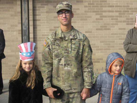 Currently serving Angel Cafasso surprised his twin niece and nephew Peyton and Miles Baker on Honor our Veterans Day.