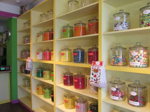 Newton candy store is a cornucopia of colors and confections Vats of candy fill the walls.