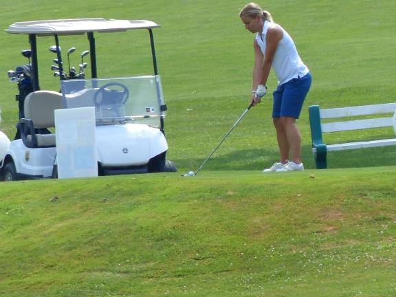 Jennifer Gardner from the Sussex County YMCA tees off during K.E.E.P.'s 20th annual golf outing in 2013.