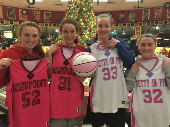 High Point and Sparta captains Madalyn Smith, April Peterson, Meghan Boryeskne and Mackensie Maguire show off the uniforms they will wear for this year's Pretty in Pink Classic Charity basketball game to be played on Jan. 31.