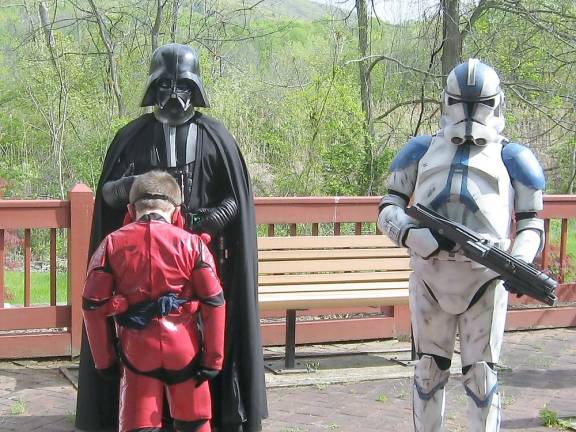 Darren Wareka, in costume, is in his glory as he spends time with Darth Vader and a storm trooper (Photo by Janet Redyke)