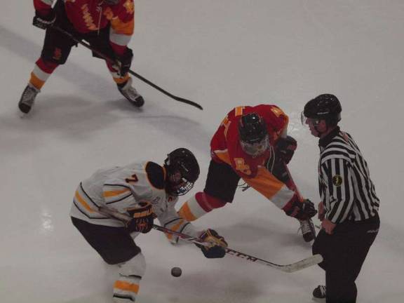 Pope John XXIII hockey tops Bergen Catholic A Pope John XXIII Lion and Bergen Catholic Crusader face off.