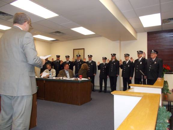 The 2015 Sussex Fire Dept. offficers are sworn in by Borough Clerk Mark Zschack.