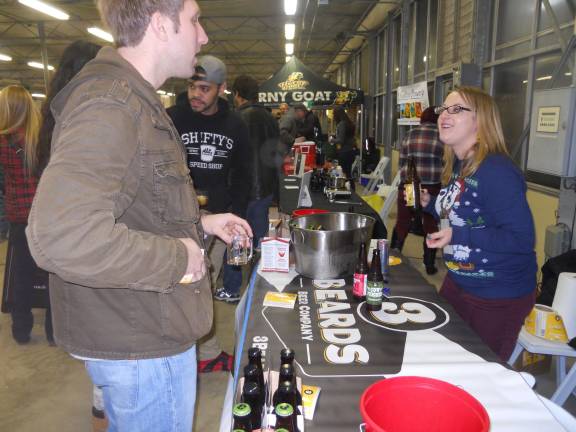 A local partakes in a sample of 3 Beards brews at the Brew Festival in Augusta in 2014. The favorite was the &quot;Cow Tipper&quot; since locals could relate to this past time in Sussex County.