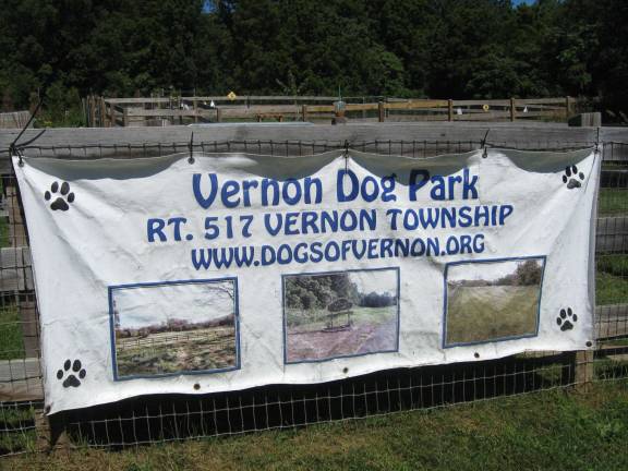 PHOTOS BY JANET REDYKE7 A banner welcomes canines and their humans to the Vernon Dog Park.