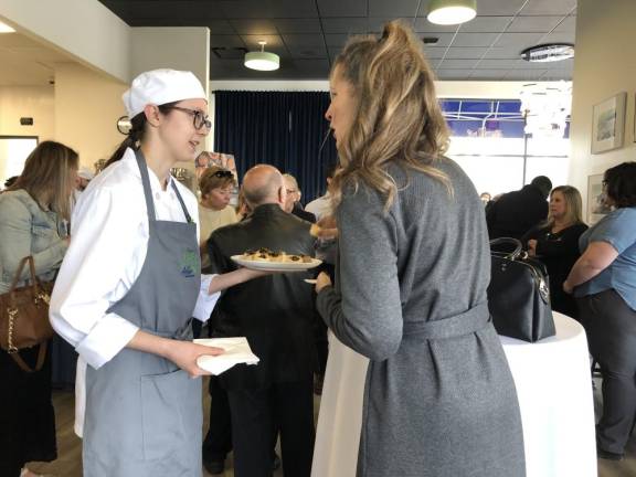 SCCC’s Culinary Institute opens A Sussex County Communty College student serves hors d’oeuvres after the ribbon-cutting ceremony at the college’s new Culinary Institute.