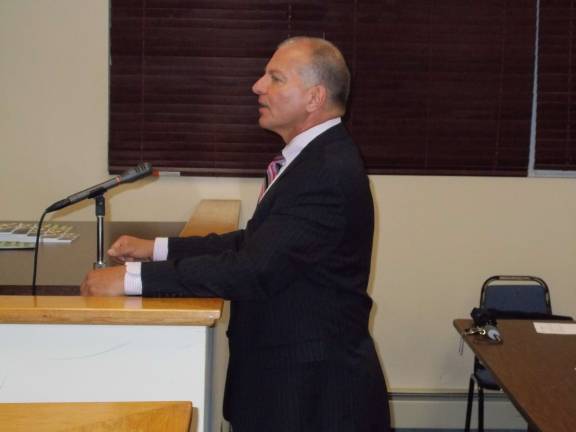 Photo by Vera Olinski Municipal Auditor Tom Ferry reviews the 2013 Sussex Borough audit report.