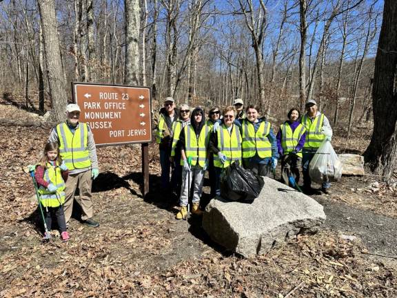 Volunteers pose during the Trail Head Cleanup on March 26.